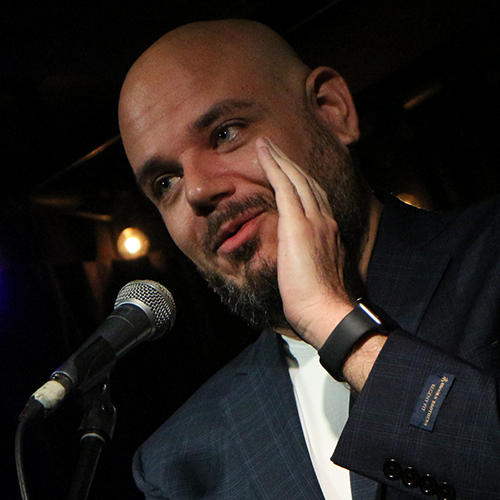 Paul Aflalo holding his phone to the microphone, so Emily Poulin can tell their story!